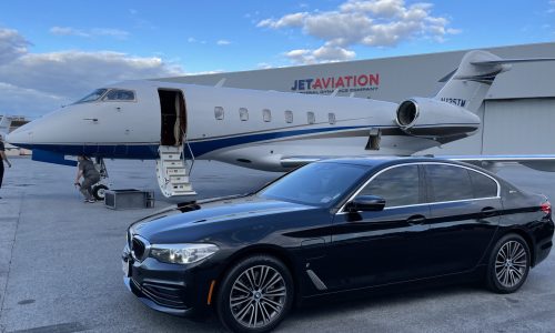 A URVIP Client reciving a door to door limo service with BMW at Jet private Aviation in Massachusetts.